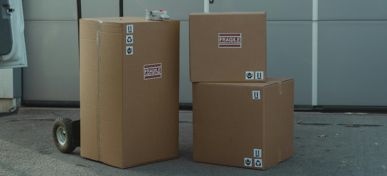 Labeled boxes stacked, illustrating how to pack fragile items securely.