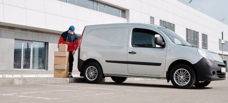 a man unloading a mini van