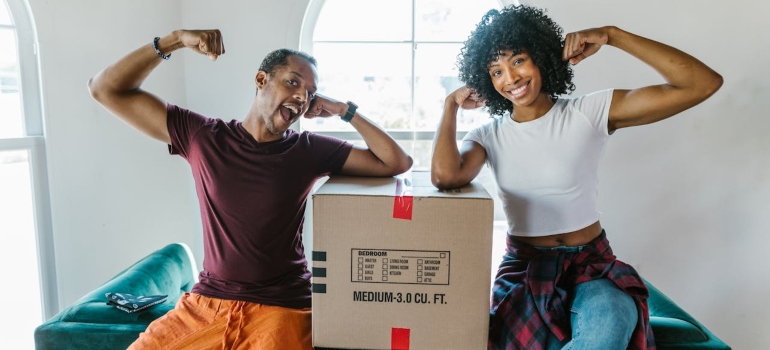 a man and a woman showing how strong they are 
