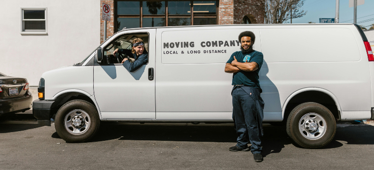 a movers next to a truck